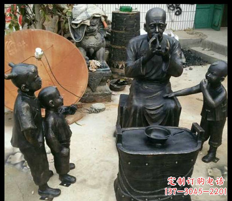 泉州步行街吹糖人的人物铜雕